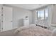 Bright bedroom featuring a storage bed, large window and white accents at 12426 Alpenglow Ct, Las Vegas, NV 89138