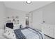 Comfortable bedroom featuring a desk and shelving at 12426 Alpenglow Ct, Las Vegas, NV 89138