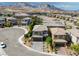 Charming two-story home featuring a landscaped yard and an inviting cobblestone driveway, nestled in a vibrant community at 12426 Alpenglow Ct, Las Vegas, NV 89138