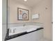 Elegant bathroom featuring a glass-enclosed shower and a luxurious soaking tub with a black marble countertop at 125 E Harmon Ave # 511, Las Vegas, NV 89109