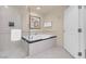 Bathroom featuring a glass shower and soaking tub at 125 E Harmon Ave # 511, Las Vegas, NV 89109