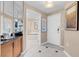 Bright bathroom with a tub, cabinets, and a tiled floor with modern fixtures at 125 E Harmon Ave # 511, Las Vegas, NV 89109