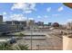 City view featuring a large parking lot surrounded by tall buildings at 125 E Harmon Ave # 511, Las Vegas, NV 89109