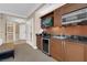 This kitchenette features a microwave, sink, mini fridge, and TV at 125 E Harmon Ave # 511, Las Vegas, NV 89109