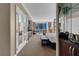 Main bedroom featuring sitting area, desk, city views, and a bar area at 125 E Harmon Ave # 511, Las Vegas, NV 89109