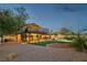 Large backyard with an elevated deck, garden, and mature trees at 1251 Los Meadows Dr, Las Vegas, NV 89110