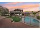 Backyard features a pool, grassy area, upper deck, desert landscape and mountain views at 1251 Los Meadows Dr, Las Vegas, NV 89110