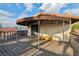 Balcony with a covered section and outdoor wooden flooring and lattice privacy at 1251 Los Meadows Dr, Las Vegas, NV 89110