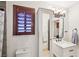 Bathroom with stylish vanity, wood-trimmed mirror, and shower at 1251 Los Meadows Dr, Las Vegas, NV 89110