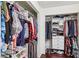Organized closet with shelves and hanging space for clothing and accessories at 1251 Los Meadows Dr, Las Vegas, NV 89110