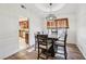 Bright dining room featuring hardwood floors and a wooden table with seating at 1251 Los Meadows Dr, Las Vegas, NV 89110