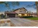 Charming two-story home with brick driveway and desert landscaping at 1251 Los Meadows Dr, Las Vegas, NV 89110