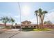 Charming two-story home showcasing a well-manicured lawn and mature palm trees for added curb appeal at 1251 Los Meadows Dr, Las Vegas, NV 89110