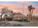 Charming two-story home with desert landscaping, a well-manicured lawn and driveway at 1251 Los Meadows Dr, Las Vegas, NV 89110