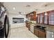 Modern kitchen with stainless steel appliances, granite countertops and dark cabinets at 1251 Los Meadows Dr, Las Vegas, NV 89110