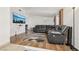 Spacious living room with hardwood floors and a comfortable sectional couch at 1251 Los Meadows Dr, Las Vegas, NV 89110