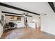 Open living room featuring wood flooring and beamed ceiling at 1251 Los Meadows Dr, Las Vegas, NV 89110