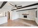 Bright living room featuring a stone fireplace and hardwood floors at 1251 Los Meadows Dr, Las Vegas, NV 89110