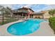 Backyard pool and patio featuring a safety fence and a view of the home's balcony at 1251 Los Meadows Dr, Las Vegas, NV 89110
