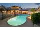 Backyard with a stunning pool and an elevated deck, perfect for entertaining at 1251 Los Meadows Dr, Las Vegas, NV 89110