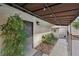 Walkway adjacent to the house features a covered entrance and landscaping elements at 1251 Los Meadows Dr, Las Vegas, NV 89110