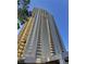 Towering high-rise condominium featuring numerous balconies and large glass windows, presenting modern urban living at 135 E Harmon Ave # 1403, Las Vegas, NV 89109