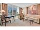 Bright living area with city views, comfortable seating, and stylish decor, ideal for urban living at 135 E Harmon Ave # 1403, Las Vegas, NV 89109