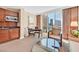 Chic living room with a kitchenette, city views, and modern furnishings, creating an inviting and stylish atmosphere at 135 E Harmon Ave # 1403, Las Vegas, NV 89109