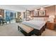 Spacious room with a luxurious bed, seating, and amazing city views at 135 E Harmon Ave # 1403, Las Vegas, NV 89109