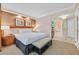 Serene bedroom featuring a plush bed, elegant decor, and access to a modern bathroom at 135 E Harmon Ave # 1403, Las Vegas, NV 89109