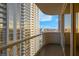 Balcony view showcasing city skyline and nearby building, offering a serene outdoor escape at 135 E Harmon Ave # 1621, Las Vegas, NV 89109