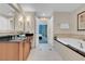 Open view of the bathroom, offering a soaking tub, glass-enclosed shower, and access to the bedroom at 135 E Harmon Ave # 1621, Las Vegas, NV 89109