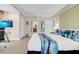Bright bedroom featuring a desk area, comfortable bed with decorative pillows, and ensuite bathroom access at 135 E Harmon Ave # 1621, Las Vegas, NV 89109
