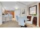 Dining area features modern chairs, a glass table, and wooden cabinetry at 135 E Harmon Ave # 1621, Las Vegas, NV 89109