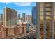 Exterior of the property showcases surrounding hotels and buildings, offering an urban living experience at 135 E Harmon Ave # 1621, Las Vegas, NV 89109