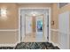 Hallway featuring neutral walls, decorative trim, and doorway views into the open interior at 135 E Harmon Ave # 1621, Las Vegas, NV 89109