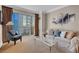 Comfortable living room offers a cozy seating area and balcony access, perfect for enjoying city views at 135 E Harmon Ave # 1621, Las Vegas, NV 89109