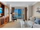Bright living room with balcony access, comfortable seating, and city views for a relaxing and enjoyable stay at 135 E Harmon Ave # 1621, Las Vegas, NV 89109