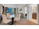 Inviting living area with dining table, sofa, and access to a bedroom, and a balcony with city views at 135 E Harmon Ave # 1621, Las Vegas, NV 89109