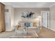 Cozy living room features a plush sofa, stylish decor, and a glass coffee table at 135 E Harmon Ave # 1621, Las Vegas, NV 89109