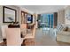 Spacious living room featuring comfortable seating, a dining area and a large window offering city views at 135 E Harmon Ave # 1621, Las Vegas, NV 89109