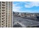 Scenic cityscape view featuring modern buildings, distant mountains, and open fields from the property at 135 E Harmon Ave # 1621, Las Vegas, NV 89109
