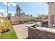 This outdoor kitchen is an entertainer's dream, set against a lush lawn and pool area at 1502 Oxbow Ct, Henderson, NV 89014