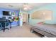 Well-lit bedroom with a ceiling fan and a large window at 1502 Oxbow Ct, Henderson, NV 89014
