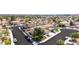 A suburban street showing multiple houses, green trees, and well-maintained landscaping at 1502 Oxbow Ct, Henderson, NV 89014