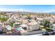Desert community home featuring a private pool, desert landscaping, and a two-car driveway at 1502 Oxbow Ct, Henderson, NV 89014