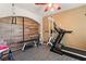 Home gym featuring workout equipment including a treadmill, weight bench, and exercise accessories at 1502 Oxbow Ct, Henderson, NV 89014