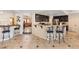 Eat-in kitchen featuring stainless steel appliances, granite countertops, and a breakfast bar at 1502 Oxbow Ct, Henderson, NV 89014
