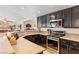 Well-equipped kitchen with stainless steel appliances, granite countertops, and breakfast bar at 1502 Oxbow Ct, Henderson, NV 89014