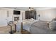 Main bedroom featuring a fireplace, TV, seating area and a view from the window at 1502 Oxbow Ct, Henderson, NV 89014